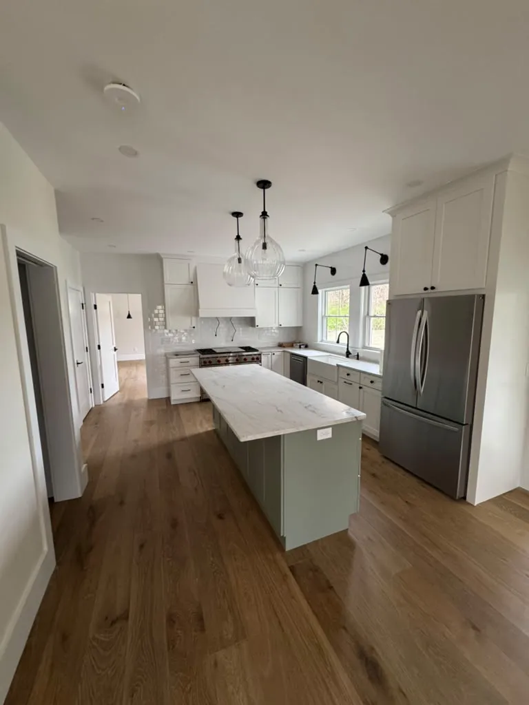 Open kitchen with island and hardwood floors